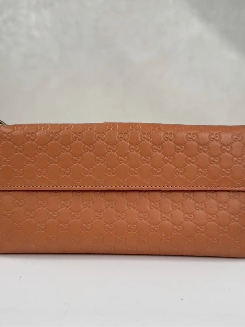 Gucci Tan Embossed Leather Clutch with Signature GG